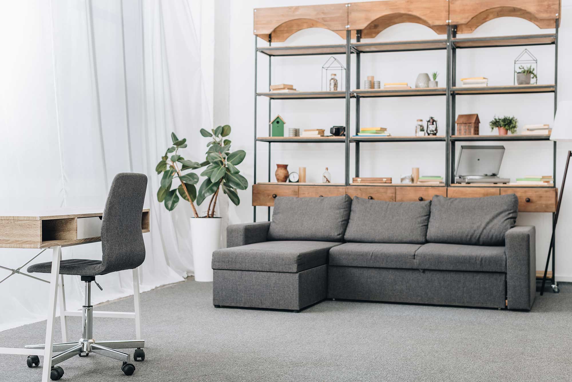 modern-living-room-with-sofa-racks-and-workspace-2023-11-27-04-56-33-utc